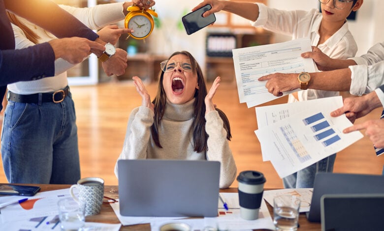 group of business workers working together. partners stressing one of them at the office